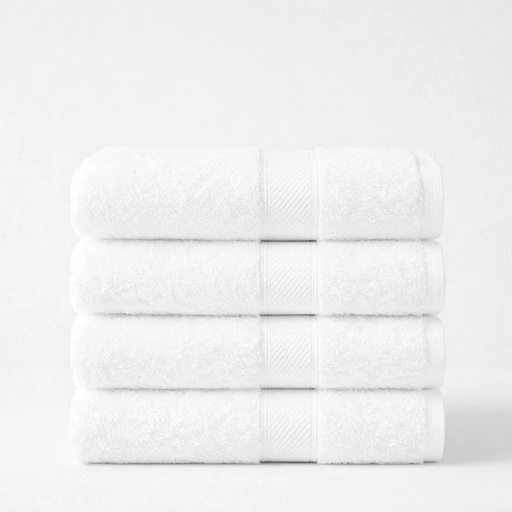 Four folded Signature bath towels in pure white